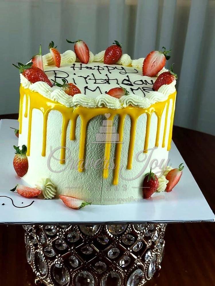 Yellow drip strawberry cake by Cravers Joy Cakes, Juja