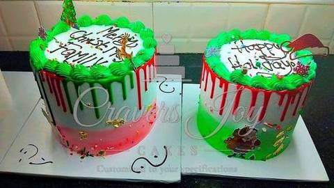 Pair of green & red Christmas drip cakes by Cravers Joy Cakes